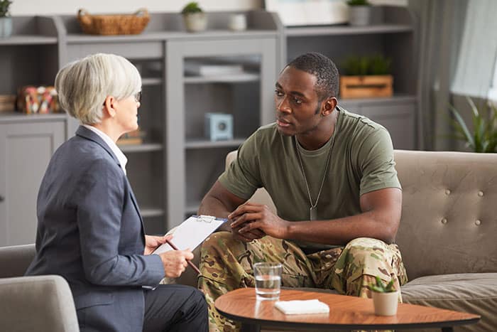 Member of the military consults with therapist